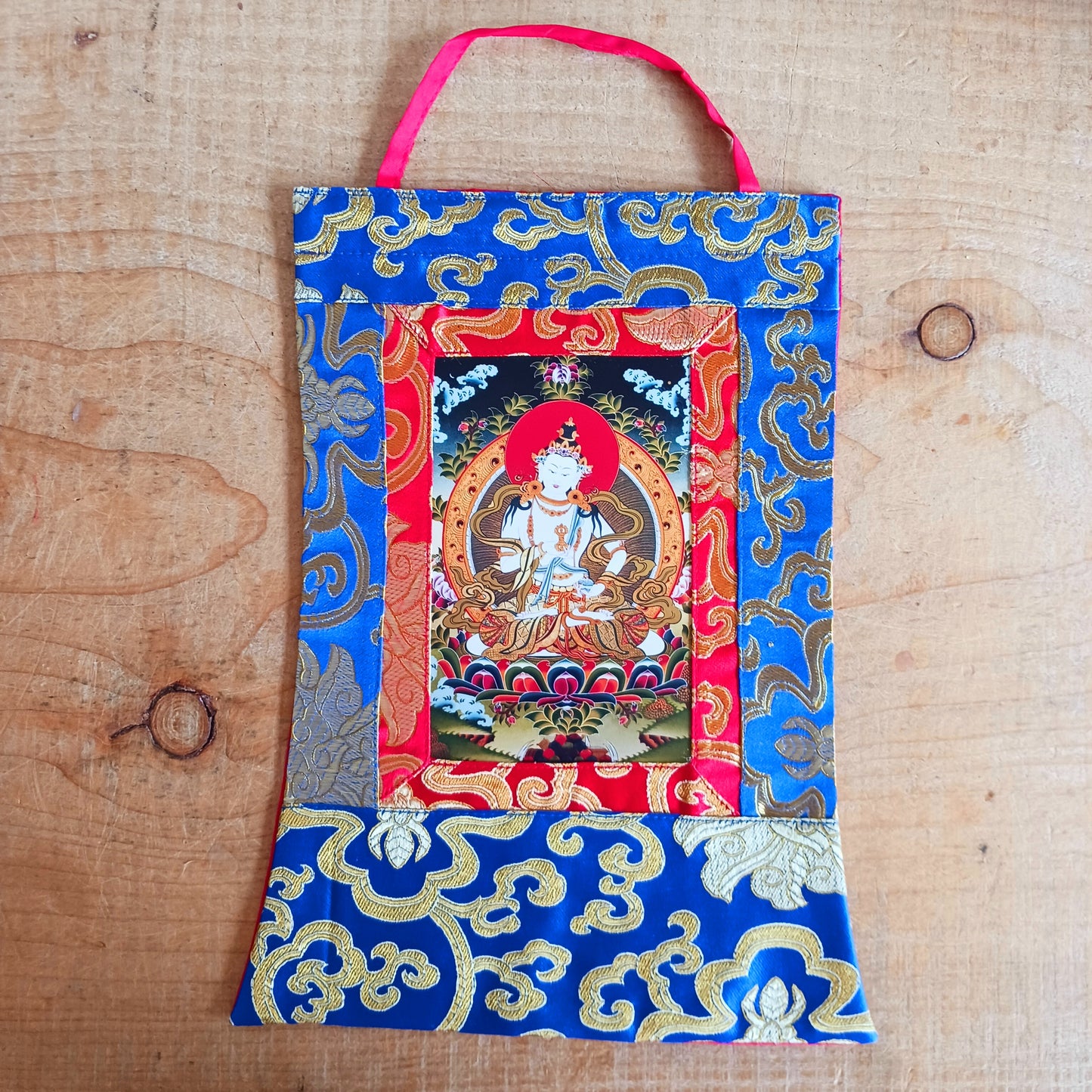 Small Vajrasattva thangka with silk brocade frame. A sacred symbol of purification in Tibetan Buddhism. Ideal for altars, gifts, or meditation practice.