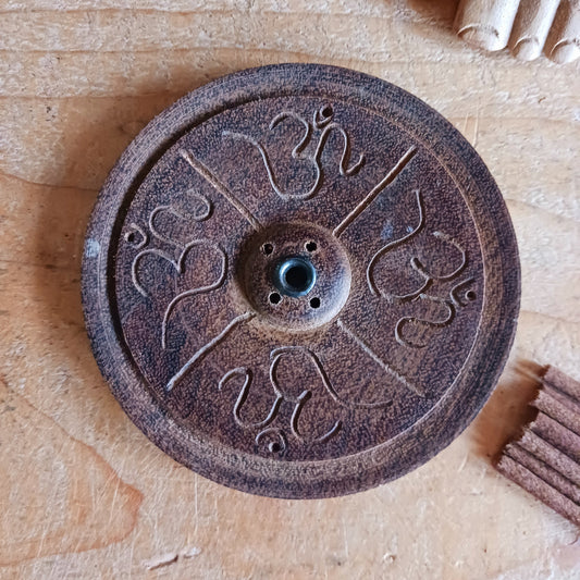 Bring a touch of serenity and spiritual elegance to your space with this handmade dark wood incense holder. Carefully carved by skilled artisans in Nepal, each holder features intricate OM symbols, representing peace, harmony, and mindfulness.