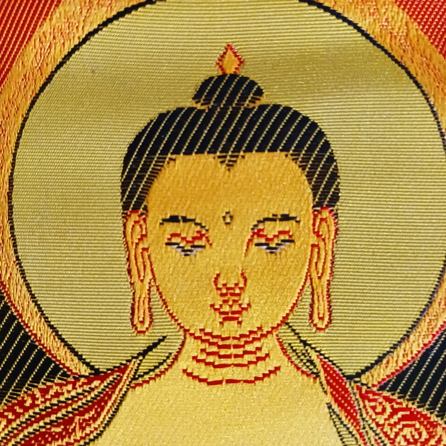 Bring serenity, beauty, and spiritual inspiration into any space with this Handmade Embroidered Buddha Thangka, crafted by skilled artisans in Nepal. Each piece is created using traditional techniques passed down through generations, featuring intricate embroidery and a rich brocade border that highlights the calm and compassionate presence of the Buddha.
