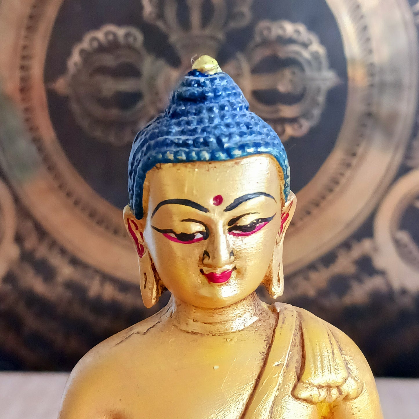 Bring serenity and spiritual elegance into your space with this stunning Shakyamuni Buddha statue. Crafted from durable clay and resin, it is meticulously painted in rich gold and traditional thangka colours, following the authentic colour patterns described in ancient texts.