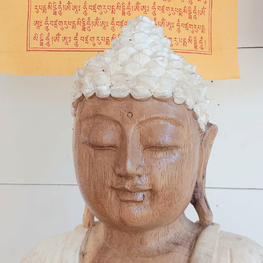 Bring calm, wisdom, and mindful intention into your space with this beautifully serene Teaching Buddha statue, hand-carved from sustainable Suar wood (Albizia Saman), a fast-growing and responsibly cultivated hardwood, finished in whitewash.