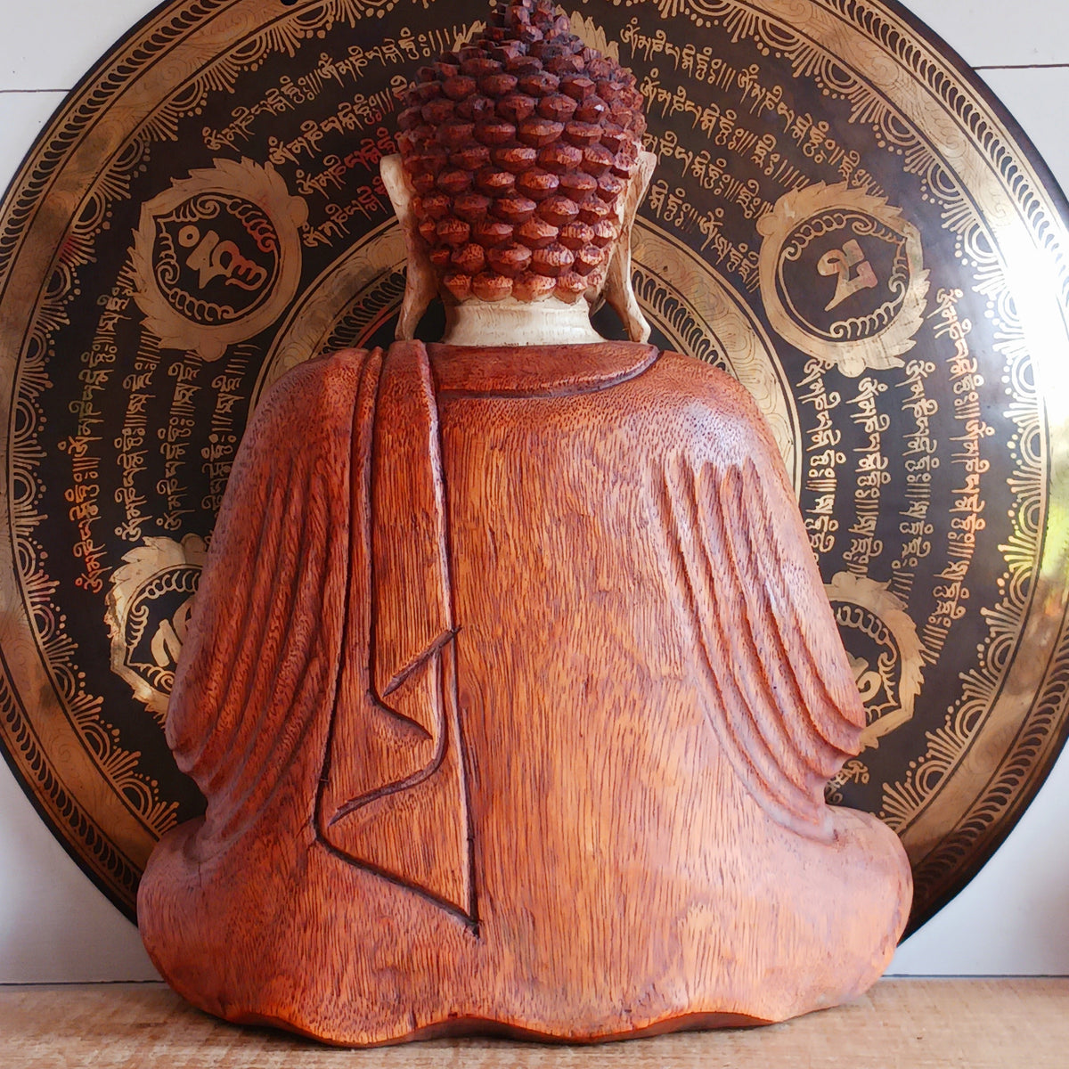 Bring a sense of peace, serenity and mindfulness into your home with this beautiful large Hand Carved Wooden Meditating Buddha Statue. Traditionally crafted in Bali from sustainable Suar wood, each statue is a unique work of art, showcasing the natural beauty of the wood and the skill of the artisan.