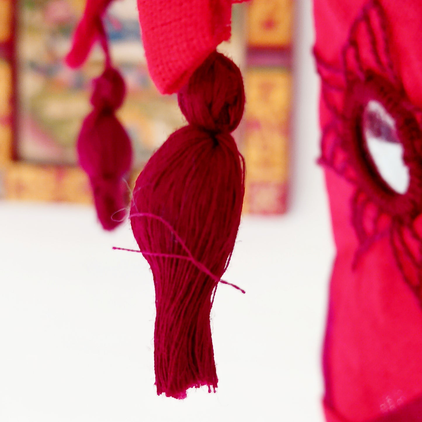 Bring colour, culture, and warmth into your space with this traditional handmade cotton Jhumar lampshade from Nepal. Carefully crafted by skilled artisans, each lampshade is made from vibrant cotton fabric and decorated with beautiful embroidered synthetic mirrors, creating a unique and eye-catching design.