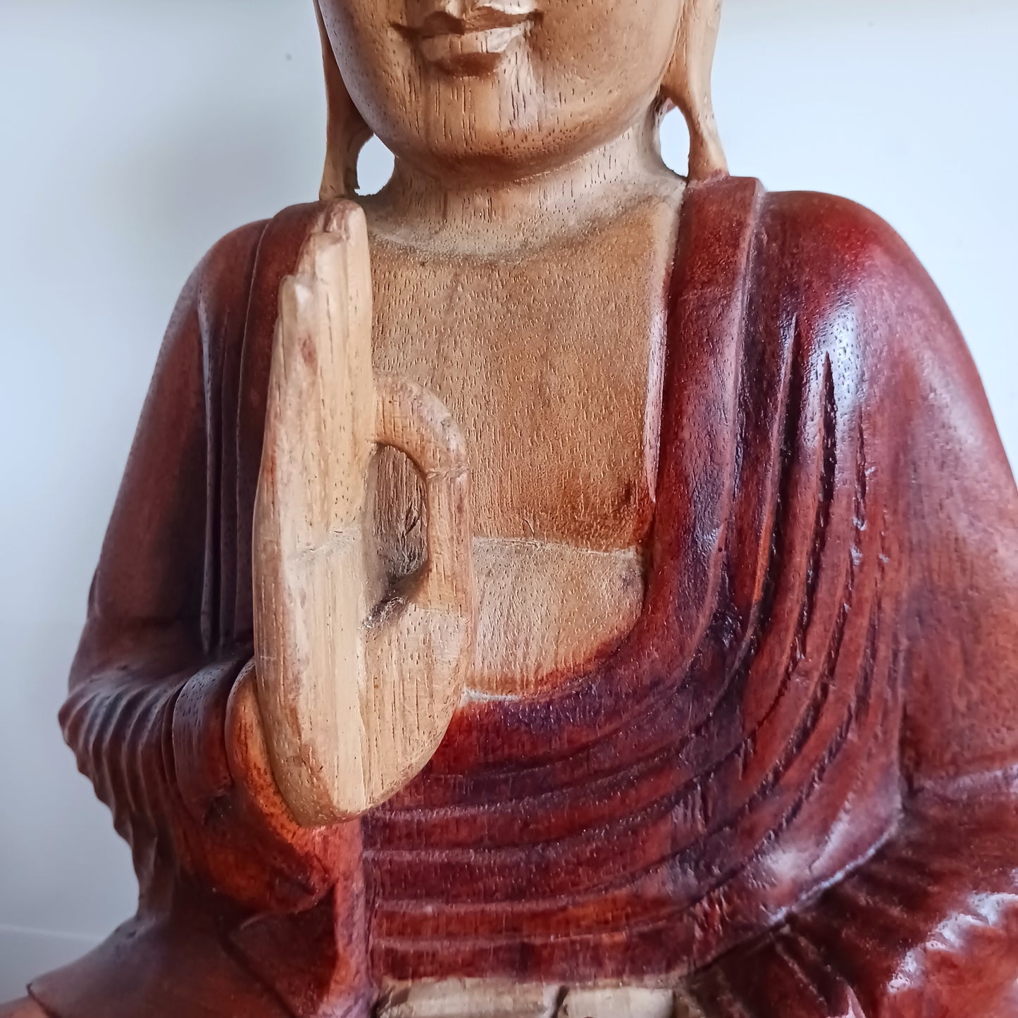 Bring calm, wisdom, and mindful intention into your space with this beautifully serene Teaching Buddha statue, hand-carved from sustainable Suar wood (Albizia Saman), a fast-growing and responsibly cultivated hardwood.