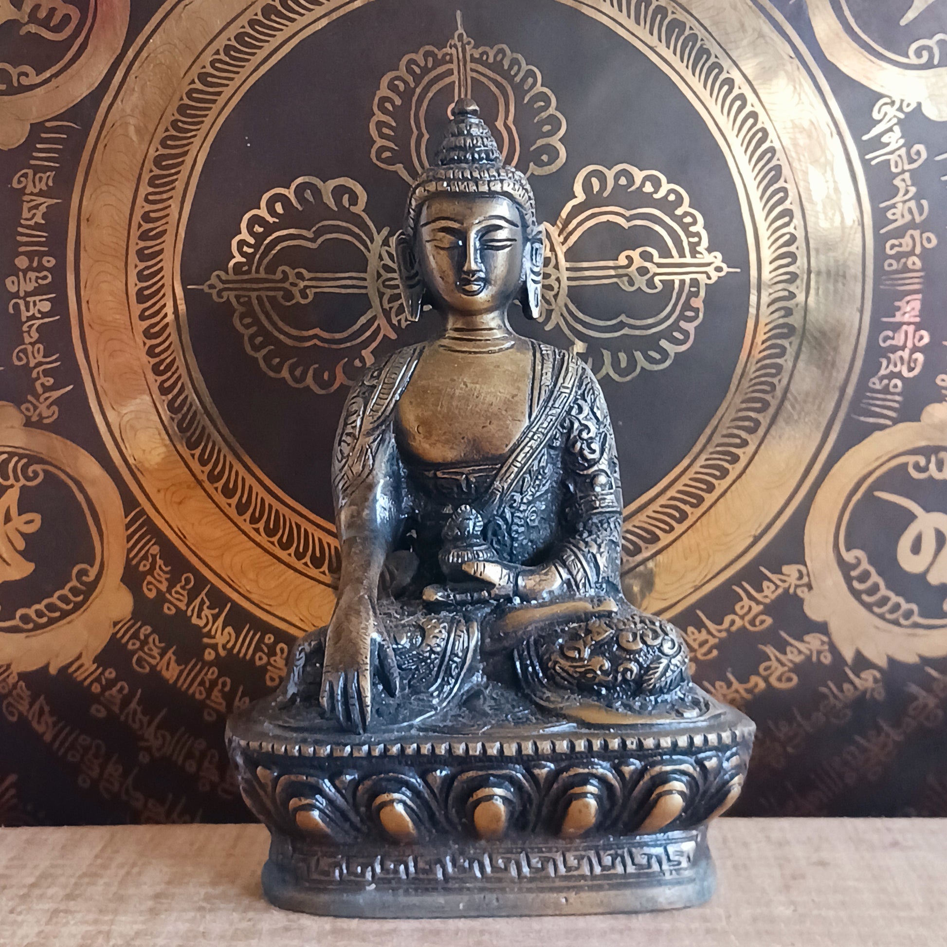 Elevate your spiritual space with this exquisite Akshobya Buddha statue, expertly cast in heavy brass and engraved with intricate detail. Representing one of the five Dhyani Buddhas, Akshobya is visualized in blue and associated with the heart chakra, symbolizing the transformation of anger and sadness into love and compassion.