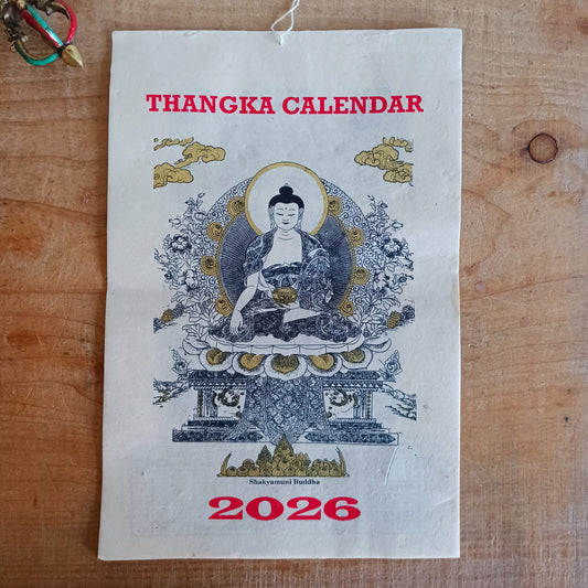 Bring the beauty, wisdom, and serenity of Buddhist art into your home with this handmade Lokta paper wall calendar, featuring seven revered Buddhist deities illustrated in traditional Thangka style. Each page showcases one of the following sacred figures: