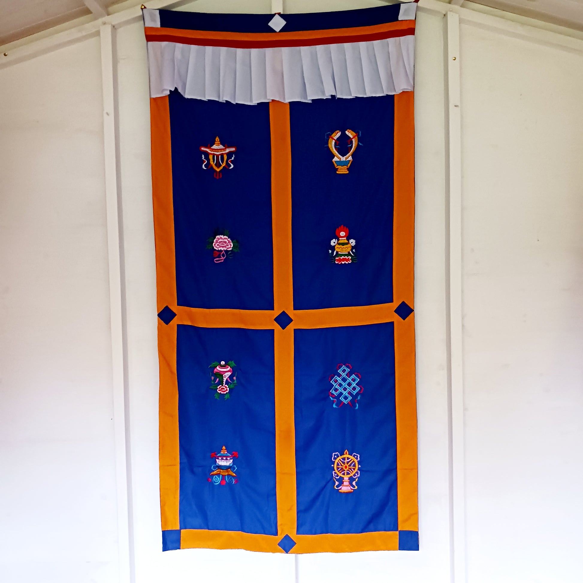 Bring harmony, beauty, and traditional craftsmanship into your space with this hand-embroidered Tibetan Buddhist door curtain, adorned with the sacred Eight Auspicious Symbols, also known as The Eight Jewels. Each symbol is intricately stitched to represent blessings of prosperity, protection, wisdom, and spiritual awakening.