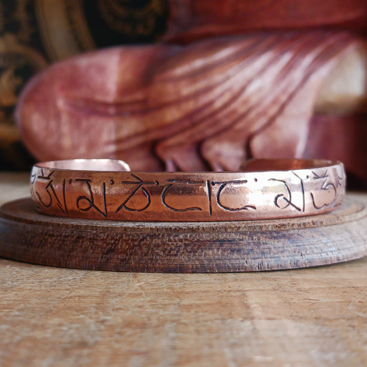 Carry meaning, mindfulness, and craftsmanship with this beautifully hand-etched copper bracelet, featuring the sacred Buddhist mantra Om Mani Padme Hum engraved around the band.