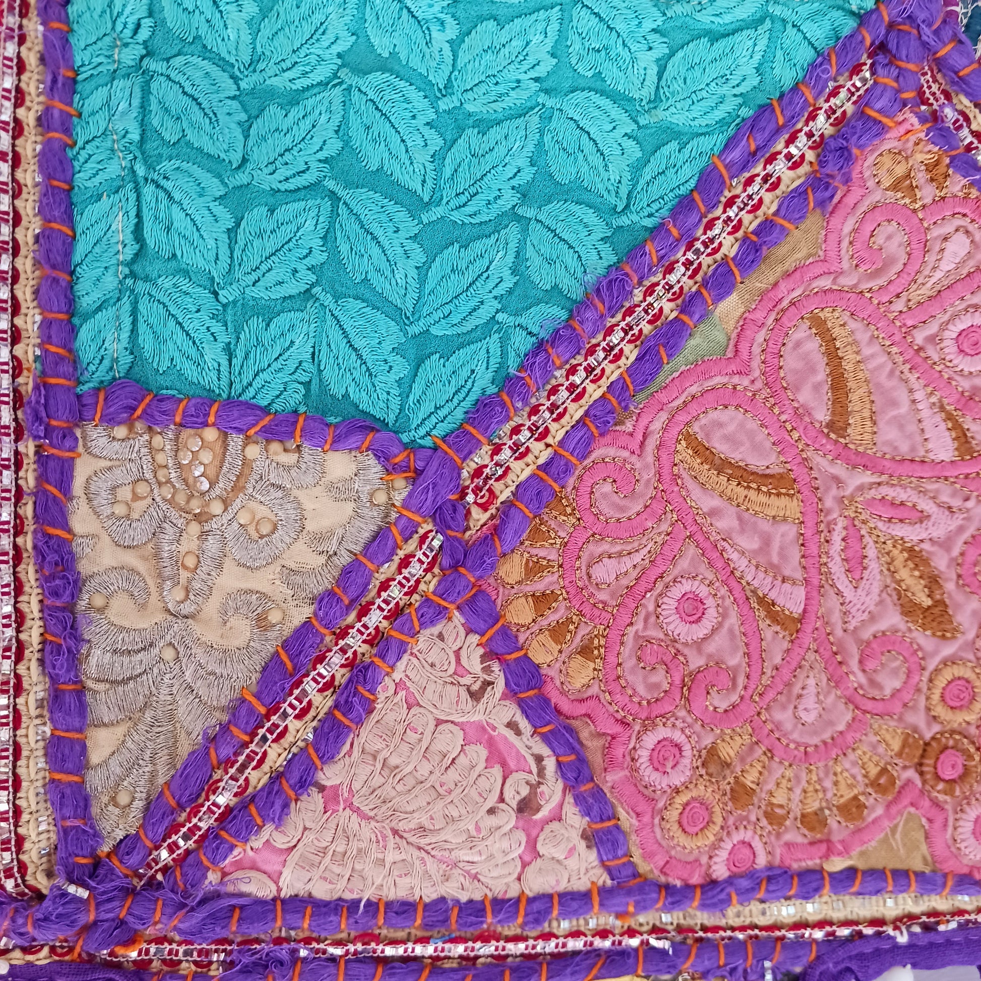 This long and beautifully intricate Indian Toran has been handmade from patches of vintage fabrics, wedding saris and recycled fabrics. It will be a unique addition to any home and bring vibrancy of colour and embellishment.