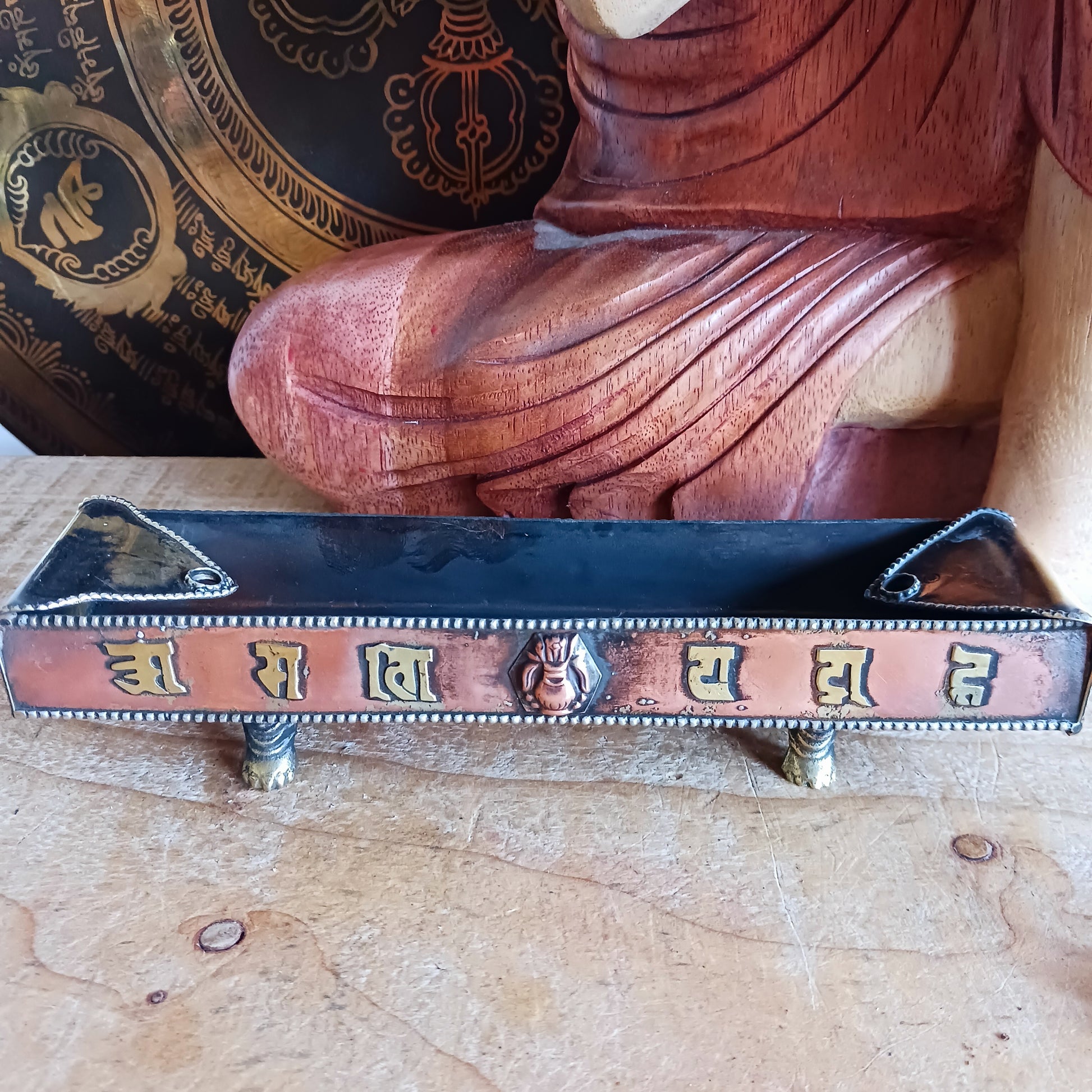 Elevate your sacred space with this traditional copper and brass incense burner, crafted with authentic Tibetan design elements. Supported by small raised feet, it provides excellent airflow for clean, even burning.