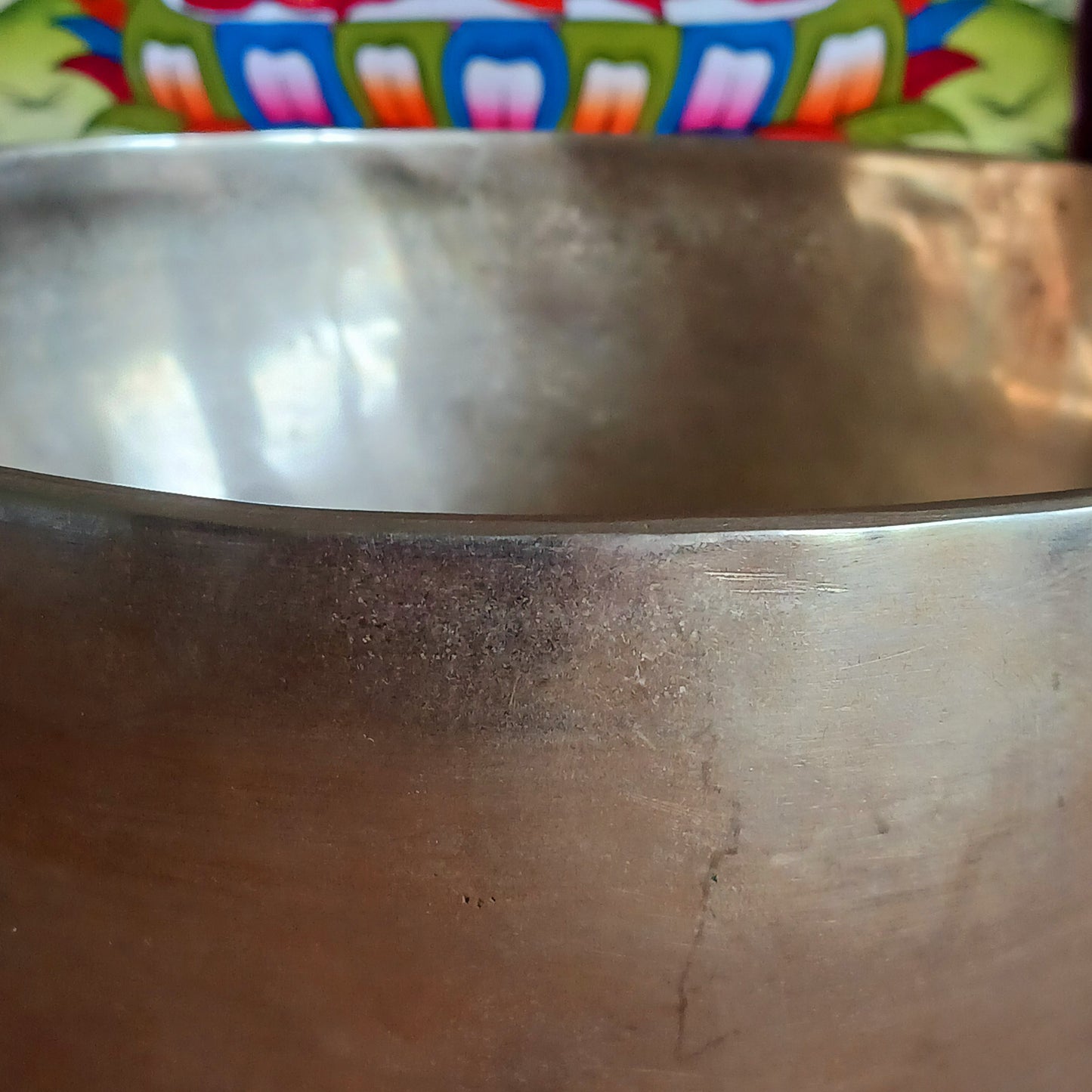 Elevate your meditation and sound healing practice with this Classic Hand-Hammered Singing Bowl, beautifully engraved with the sacred OHM symbol inside the bowl. This is a unique, one-of-a-kind item—you will receive exactly the bowl pictured.