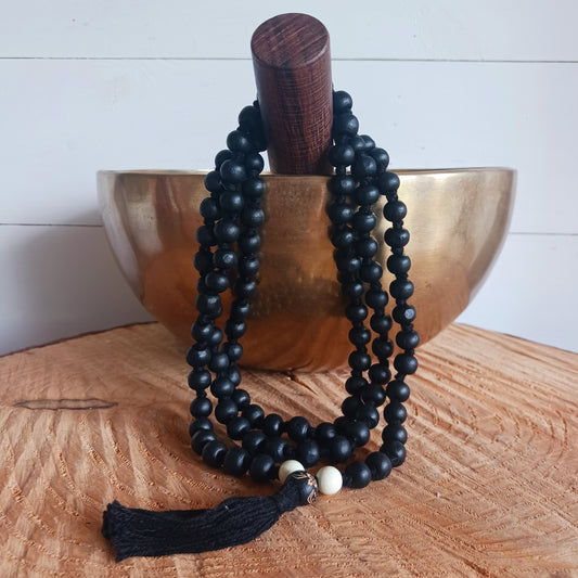 Handmade black wood Mala is idea for meditation. Each bead measures approximately 5-6mm, the mala measures approximately 55cm long.