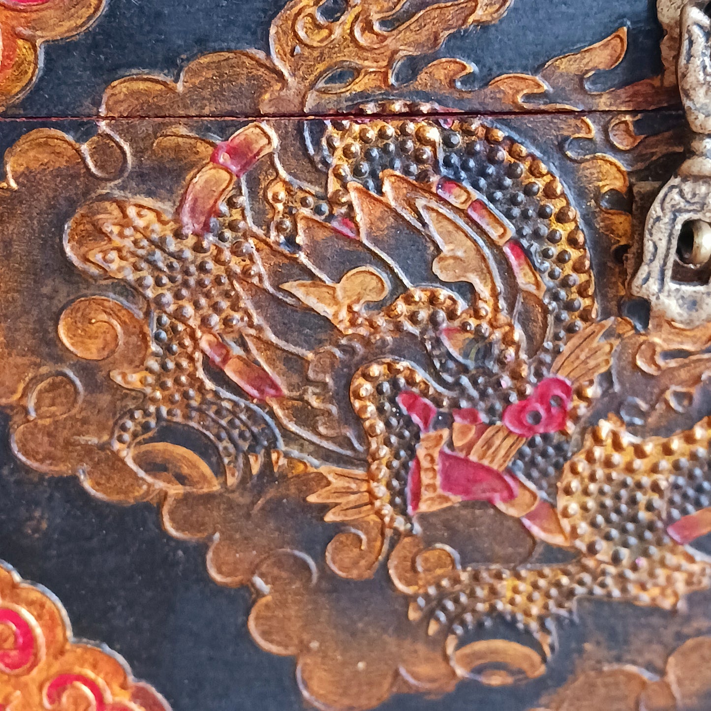 These beautiful hand painted traditional Tibetan treasure box has been carefully handcrafted in Kathmandu, Nepal by a small group of Tibetan artists. The boxes are hand painted with a dragon motif on the front, Yin Yang and Eternal Knot designs on the top in black, gold and red paint.