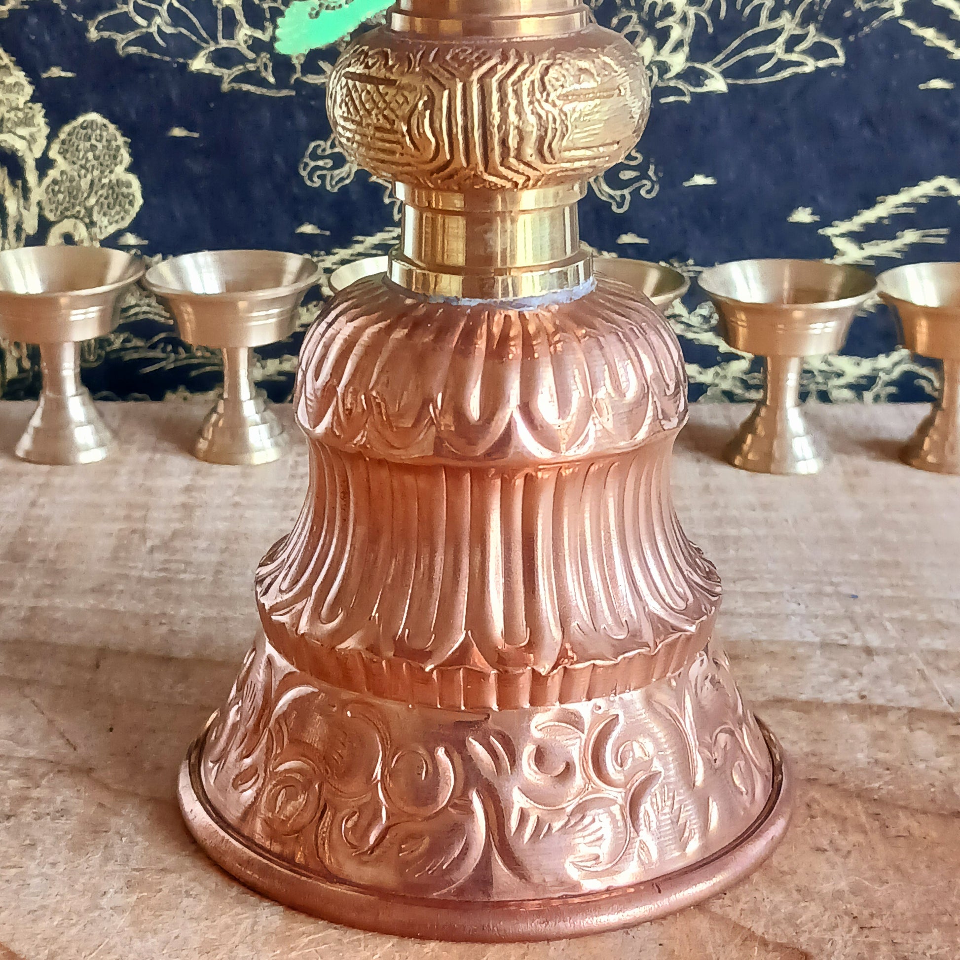 Illuminate your sacred space with this Large Copper Butter Lamp, beautifully handcrafted and engraved with traditional Tibetan auspicious symbols around the sides. Commonly used in Tibetan temples, these lamps are filled with yak butter, vegetable oil, or ghee and offered as a light to symbolize wisdom and clarity. Each morning, Tibetan Buddhists light butter lamps as a spiritual act of devotion and illumination. Perfect for altars, meditation spaces, or as a unique cultural centerpiece, this lamp brings bo