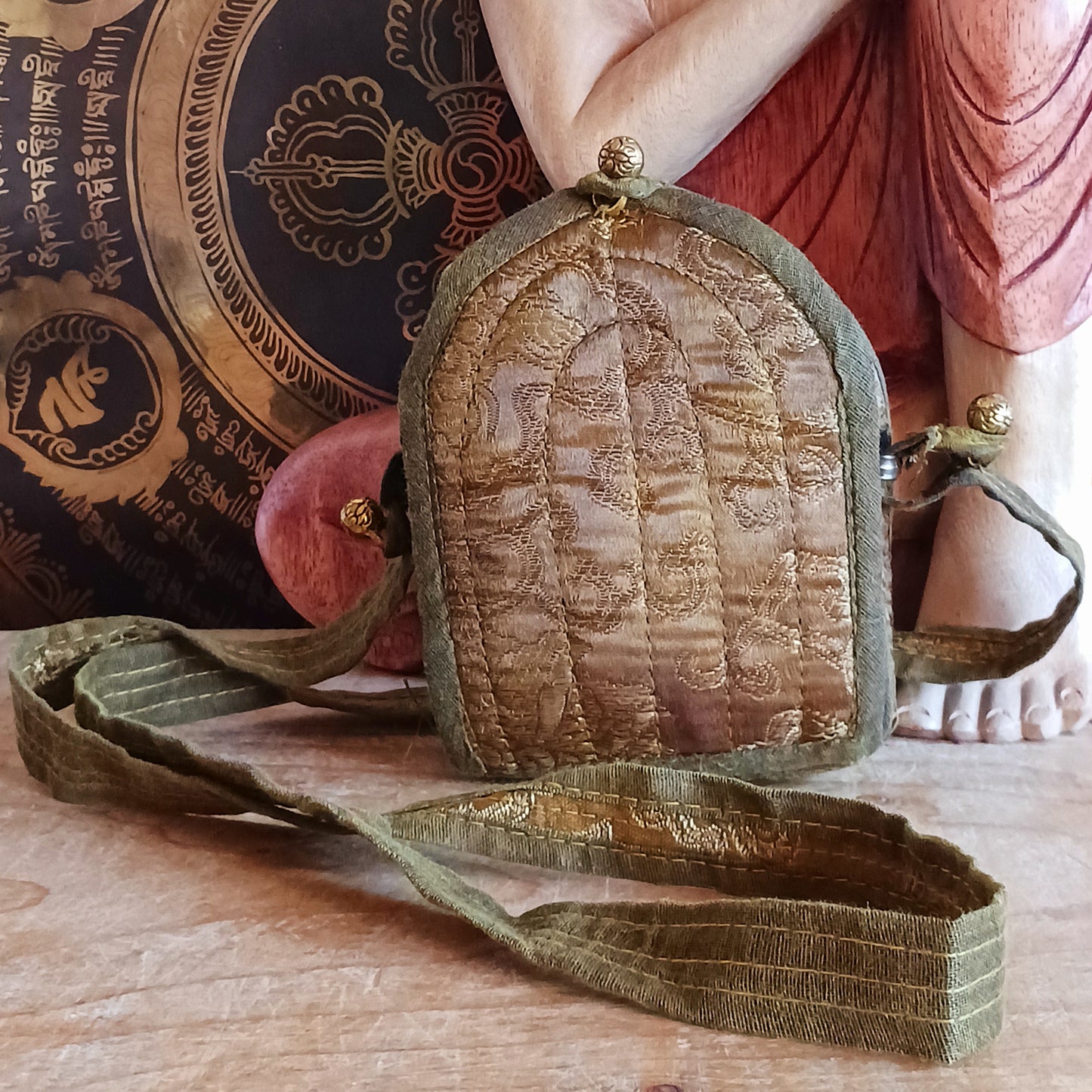 Discover the spiritual power of the Tibetan Ghau, a portable shrine and traditional prayer box used to carry sacred relics, charms, and medicinal herbs. Crafted by skilled Tibetan refugee artisans in Nepal, each Ghau serves as a portable shrine offering protection and blessings during travel. Wear it as a pendant around your neck or hang it from a waist sash or belt. This handcrafted piece is not only a spiritual talisman but also a beautiful work of art, connecting you to centuries-old Tibetan traditions.