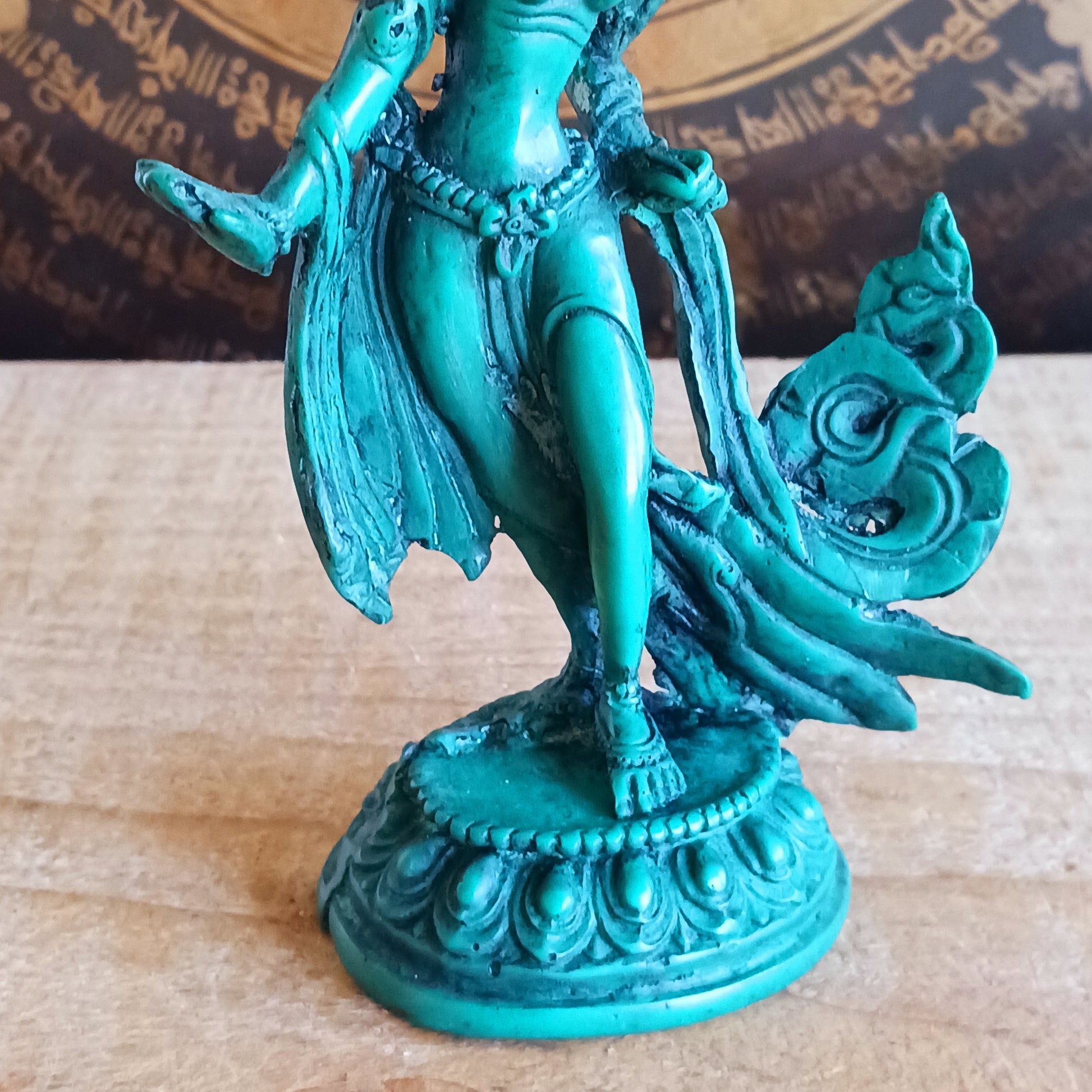 Honour the presence of compassion, protection, and enlightened wisdom with this beautifully hand-painted resin statue of Green Tara. Representing one of the 21 revered forms of Tara, this statue depicts her in a graceful standing posture, hands in the varada mudra—the gesture of generosity, blessing, and compassionate offering.