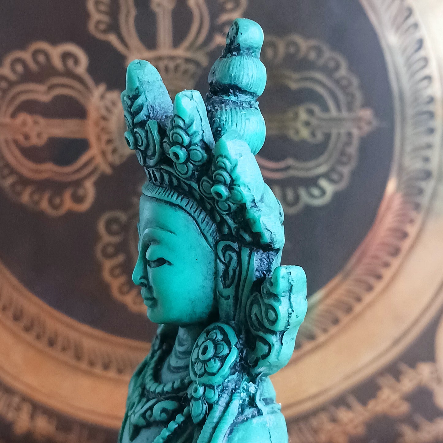 White Tara is known for compassion, long life, healing and serenity and is shown here with her right hand in the varada mudra (blessing pose.) White Tara is distinct from the more commonly seen Green Tara. She is seated in a tranquil, full lotus position as opposed to Green Tara's one foot extended pose. These intricate resin statues are carefully handcrafted in Nepal.