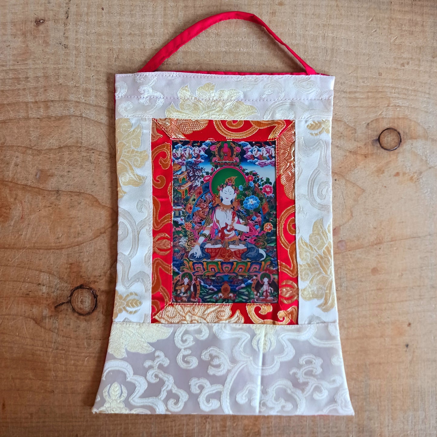 Beautiful small thangka of White Tara with silk brocade. Symbol of purity, compassion & longevity. Ideal for meditation, altar, or spiritual décor.