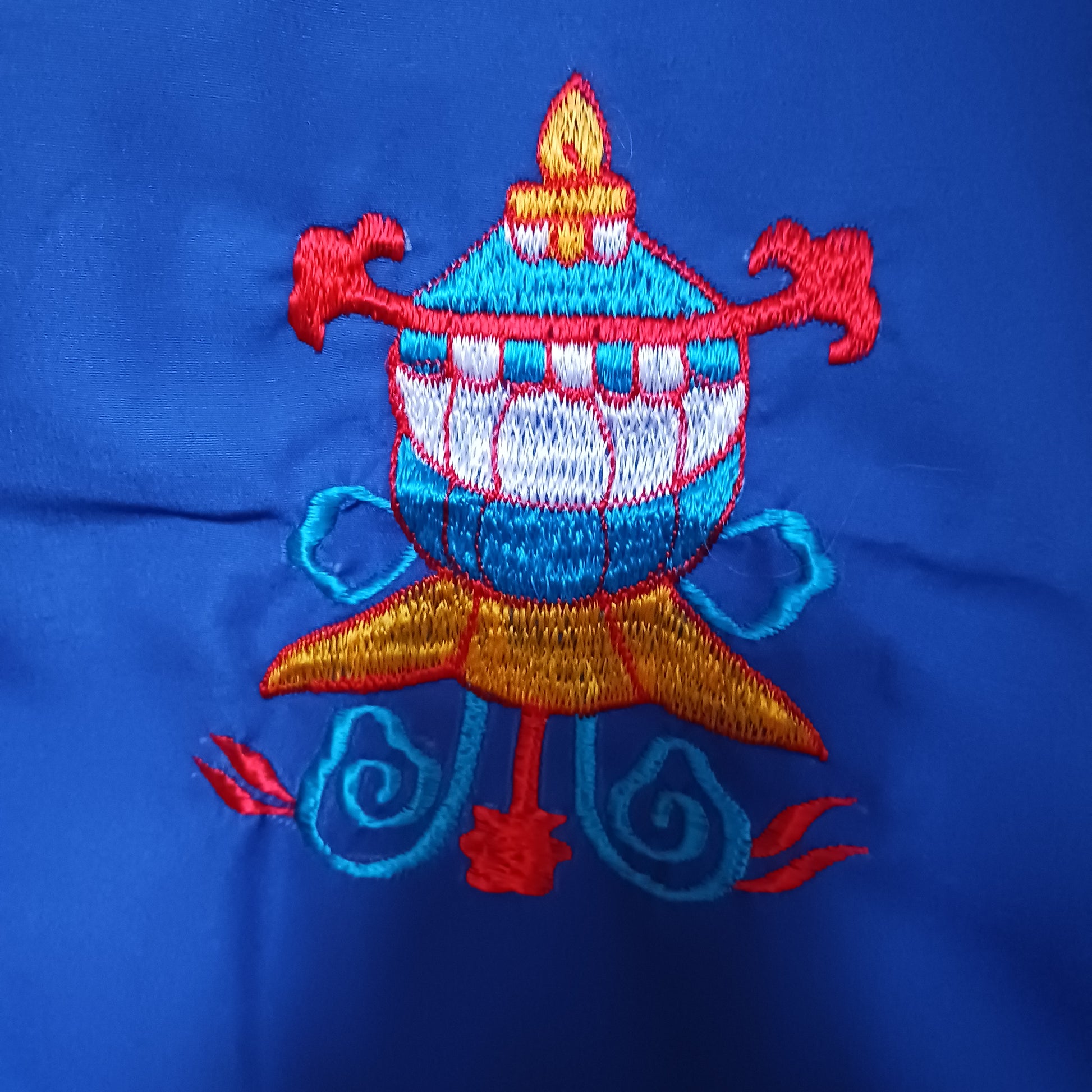 Bring harmony, beauty, and traditional craftsmanship into your space with this hand-embroidered Tibetan Buddhist door curtain, adorned with the sacred Eight Auspicious Symbols, also known as The Eight Jewels. Each symbol is intricately stitched to represent blessings of prosperity, protection, wisdom, and spiritual awakening.