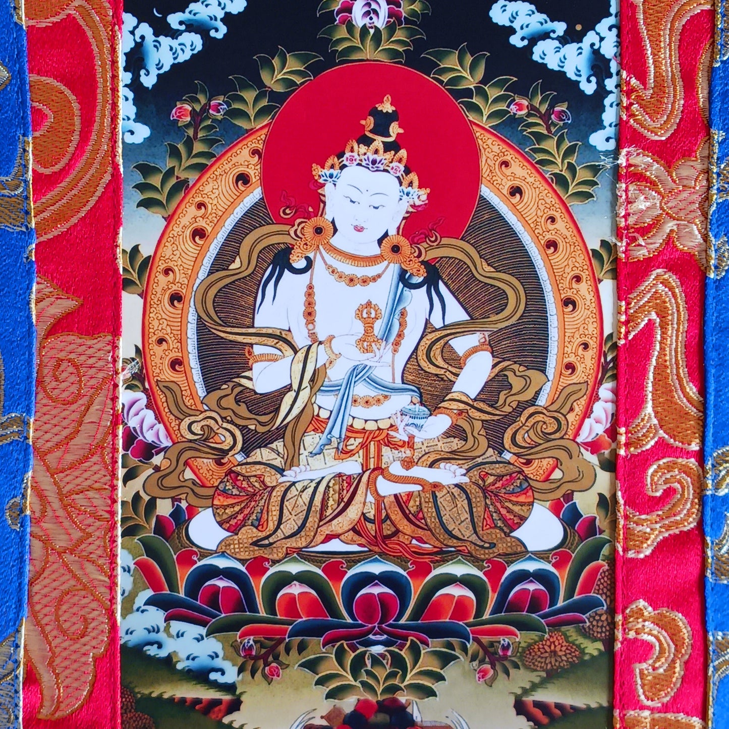 Small Vajrasattva thangka with silk brocade frame. A sacred symbol of purification in Tibetan Buddhism. Ideal for altars, gifts, or meditation practice.