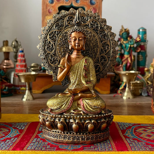 Buddha of Reassurance with aura and throne