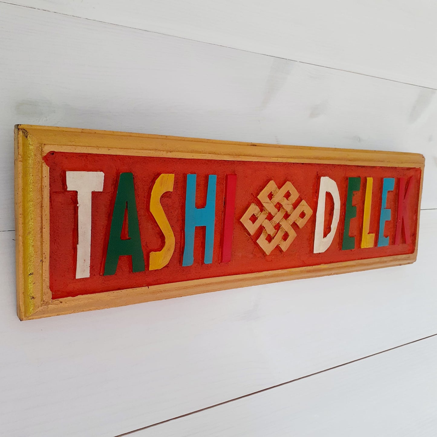 Tibetan Tashi Delek sign wooden wall décor 30 x 9 cm