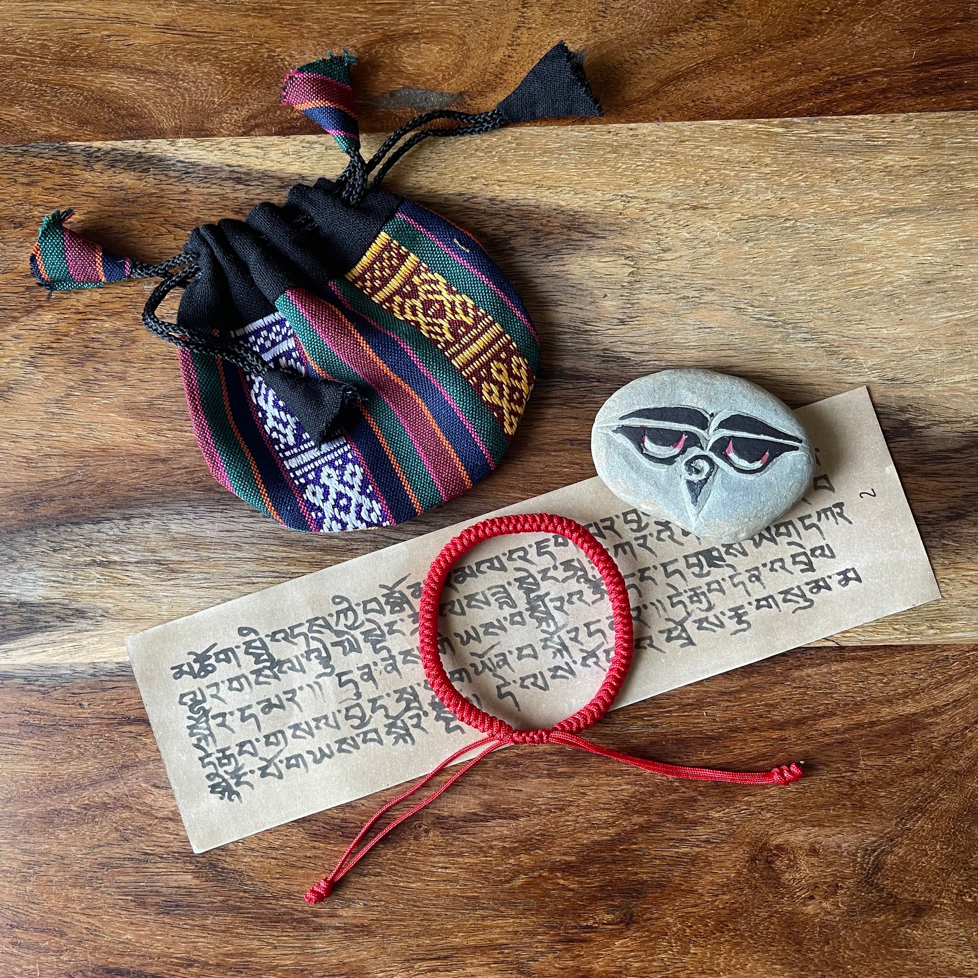 Lucky Tibetan Red Cord bracelet with Nepalese Pouch